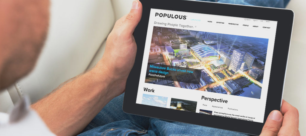 Populous home page screen on an ipad held by a man