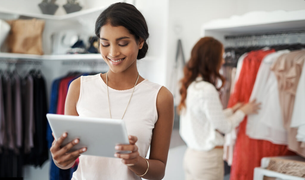 Women working Retail with creating a winning website experience on a tablet