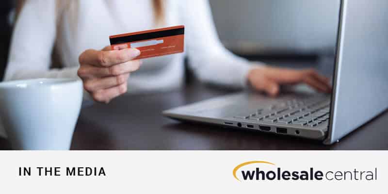 Woman ordering on laptop with credit card: Optimizing Digital Customer Experiences