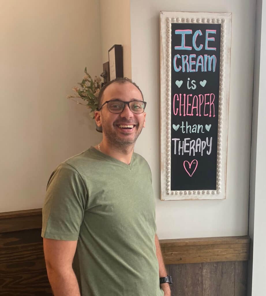 Moustafa enjoying the ice cream shop's decor during the company retreat in Atlanta, GA