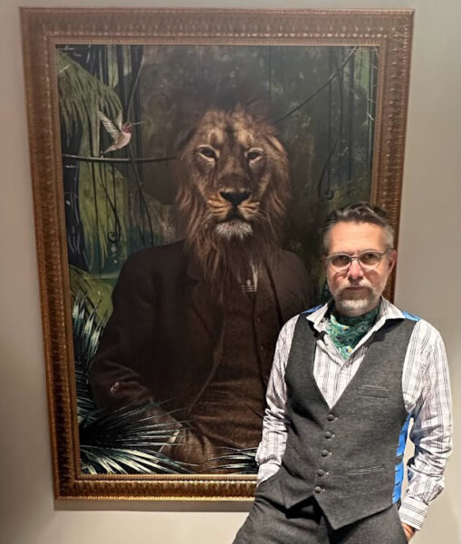 Ant posing with lion portrait during the Company Retreat in Atlanta
