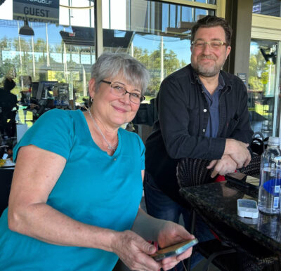 Janet and Karim at Top Golf during the 2023 Company Retreat in Atlanta, GA